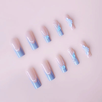 Kunstnagelset mit zarten floralen Akzenten und eleganten Verzierungen Brehn