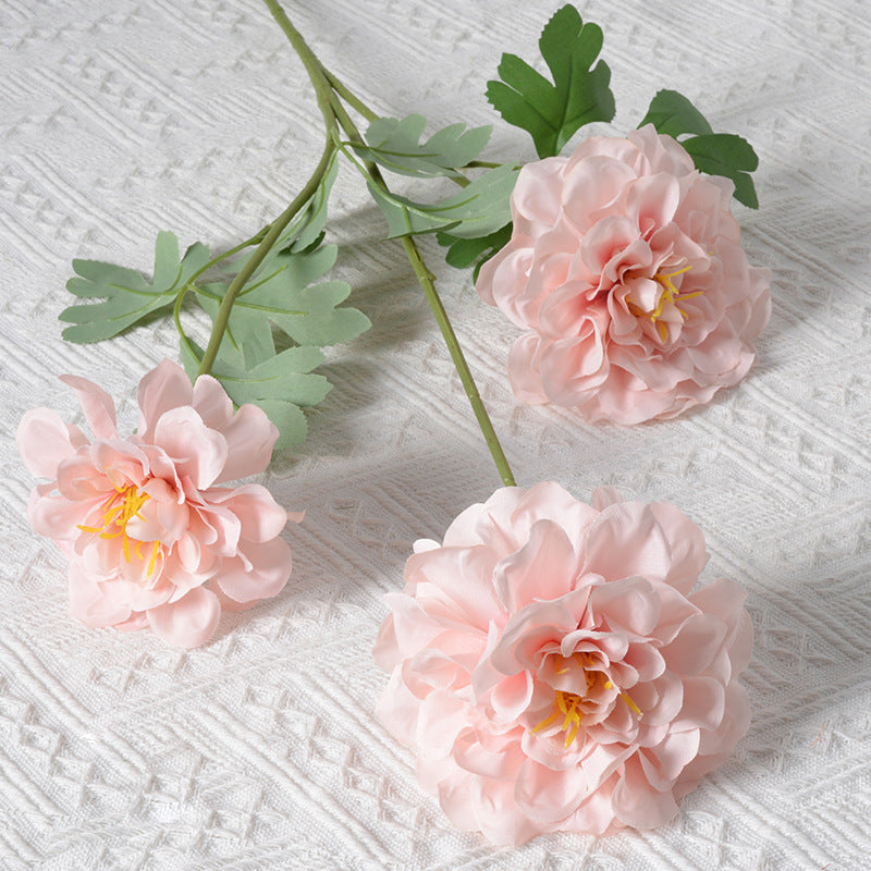 Künstliches Blumenarrangement mit Ringelblumen