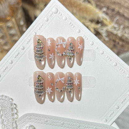 Dekoratives Stiletto Press-On Nagelkunst-Set mit Schneeflocken- und Edelsteinakzenten Brehn