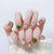 Kunstnagelset mit funkelnden 3D-Applikationen und wunderschönen Herzmotiven Brehn