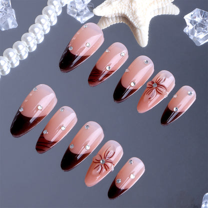 Kunstfingernägel mit Elegantem Blüten-Design und Glitzerakzenten Brehn