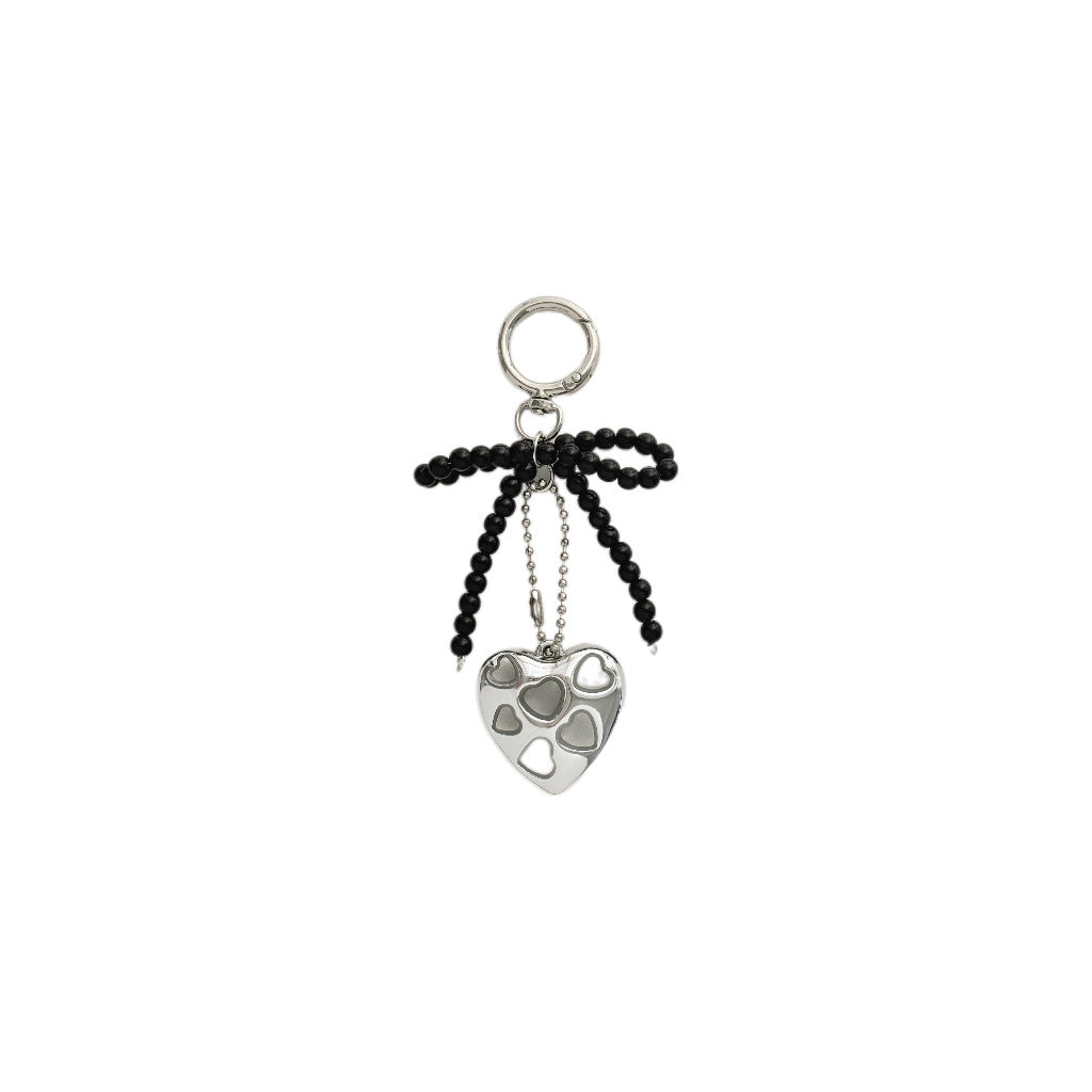 Herzförmiger Charm-Schlüsselanhänger mit Perlen-Schleife Brehn