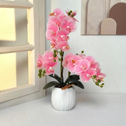 Lebensechte dekorative Orchideenarrangement für Tischdekoration