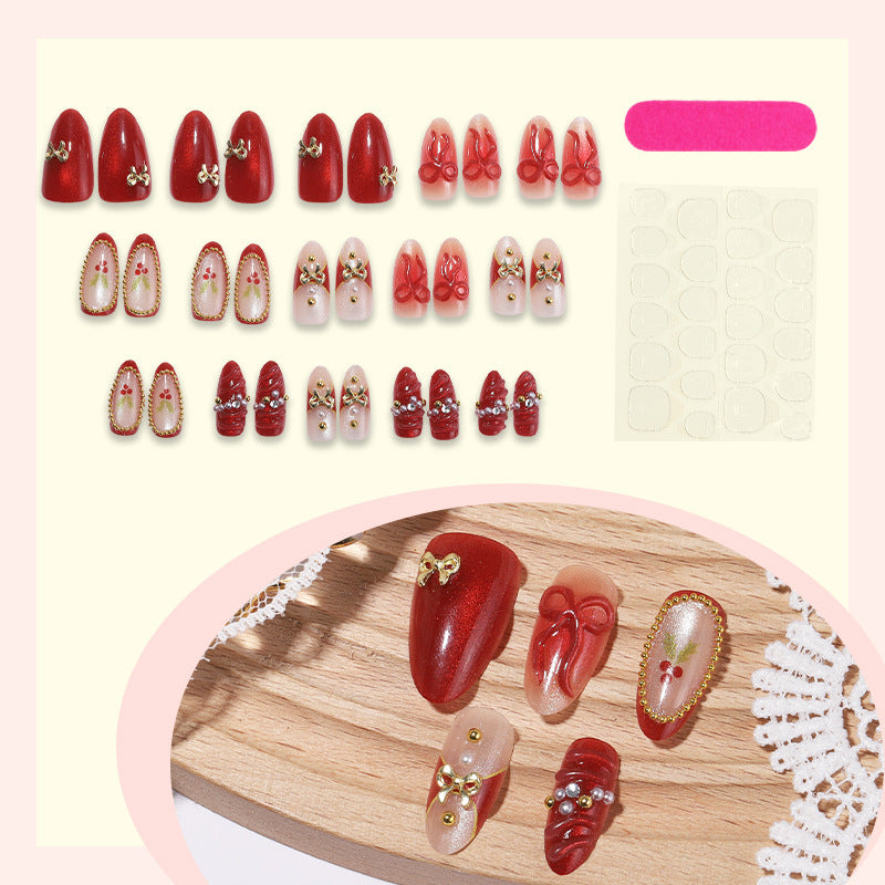 Kunstnagelset mit glamourösen Schleifen und funkelnden Details Brehn