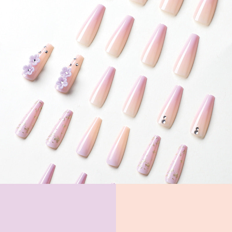 Kunstvolle Gel-Nägel mit Floral-Design und Glitzerakzenten Brehn