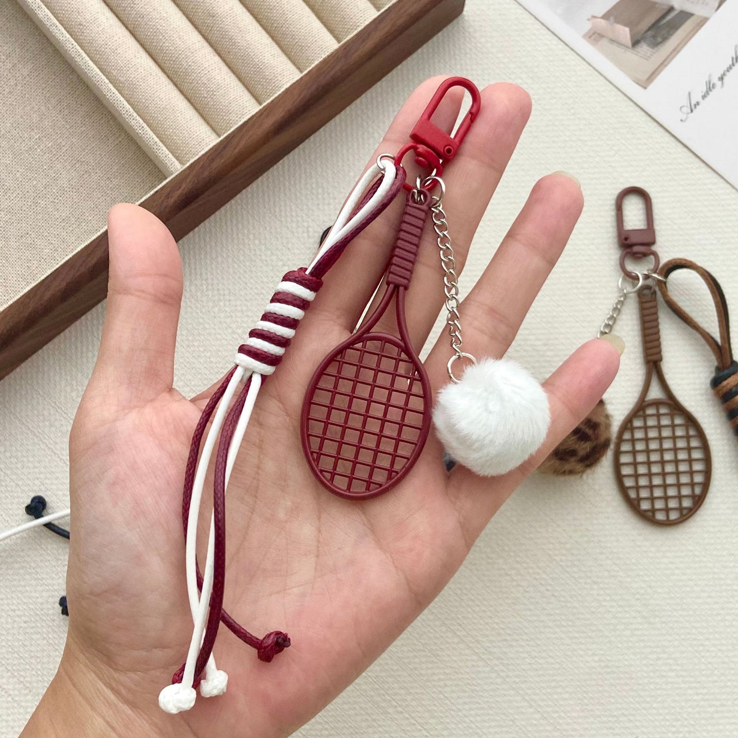 Tennisracket und Pelzball Schlüsselanhänger Brehn