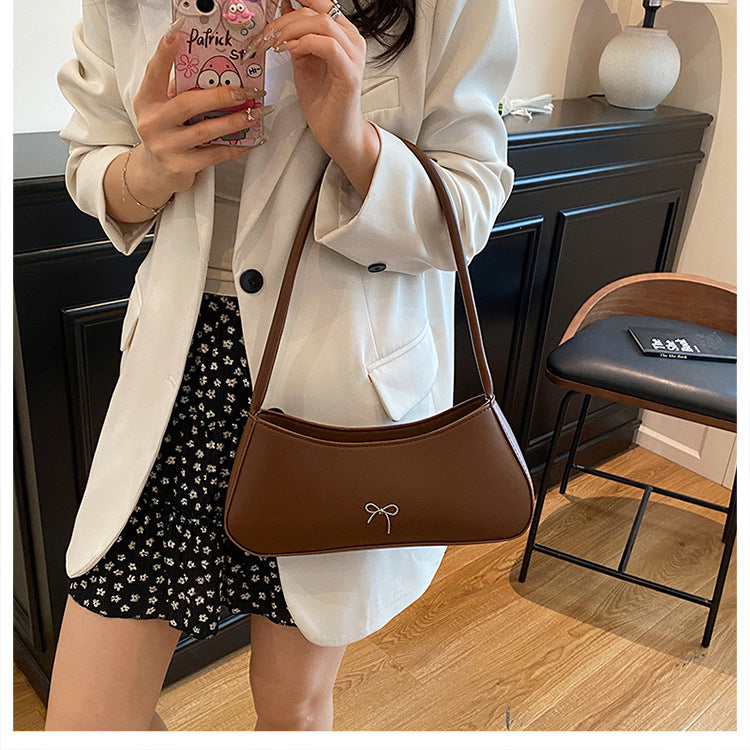Elegante geschwungene Handtasche Brehn