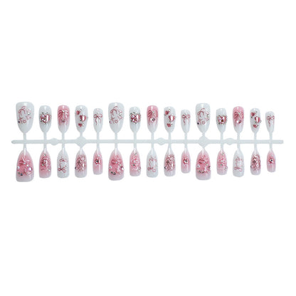 Kunstnagelset mit filigranen Blumen- und Glitzermotiven Brehn