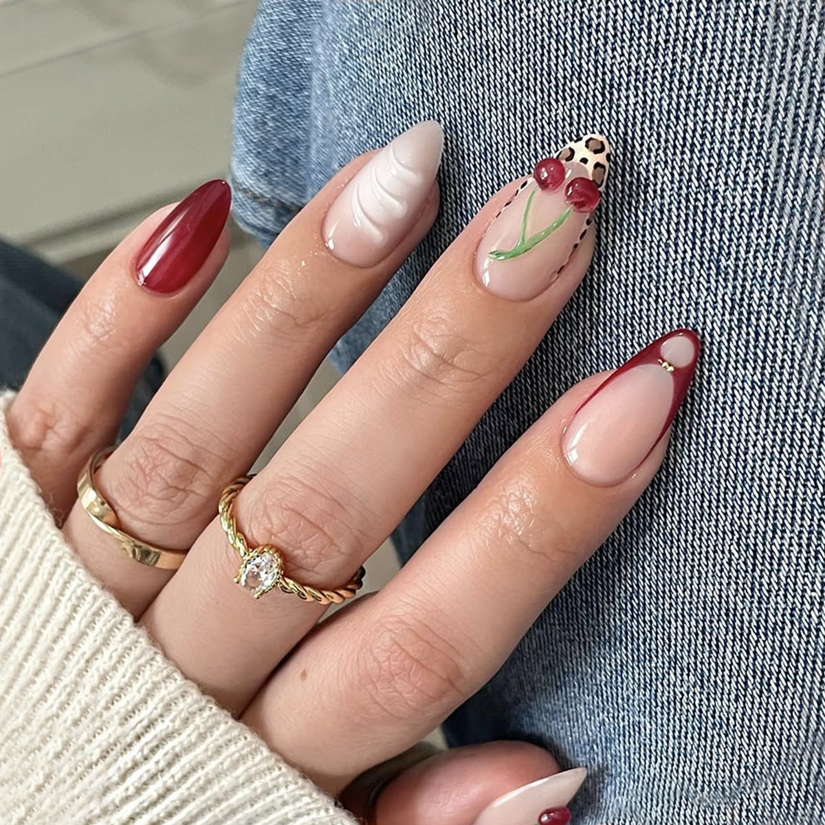 Kreatives Nageldesign mit stilvollem Blumen- und Leopardenmuster Brehn