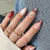 Kreatives Nageldesign mit stilvollem Blumen- und Leopardenmuster Brehn