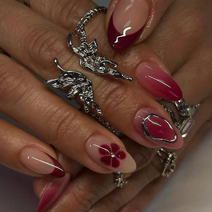Kunstnagelset mit eleganten Blüten- und Ombre-Akzenten Brehn