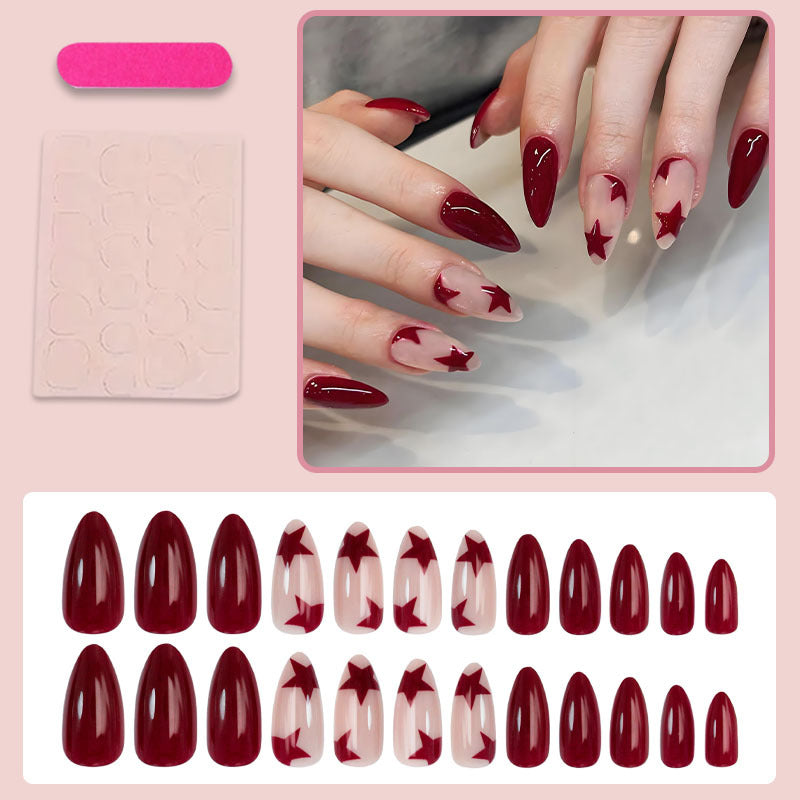 Kunstnagelset mit glitzernden Sternen und eleganten Akzenten Brehn