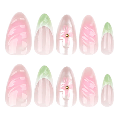Kunstvolle Nagelverlängerungen mit floralem Design und glamourösen Akzenten Brehn