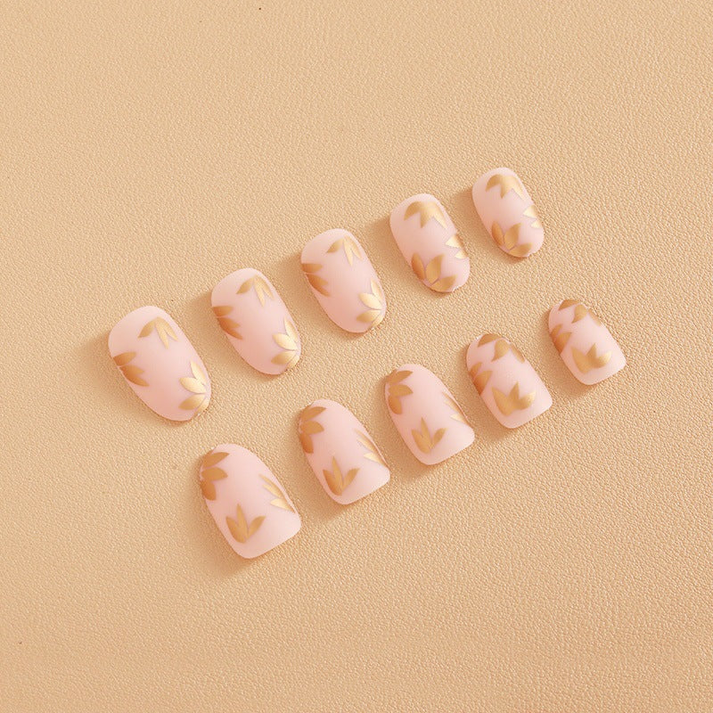 Kunstnagelset mit elegantem Goldblatt-Design Brehn