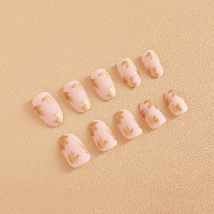 Kunstnagelset mit elegantem Goldblatt-Design Brehn