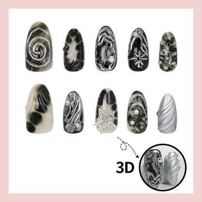 Kunstnagelset mit künstlerischen Mustern und Glitzerakzenten Brehn