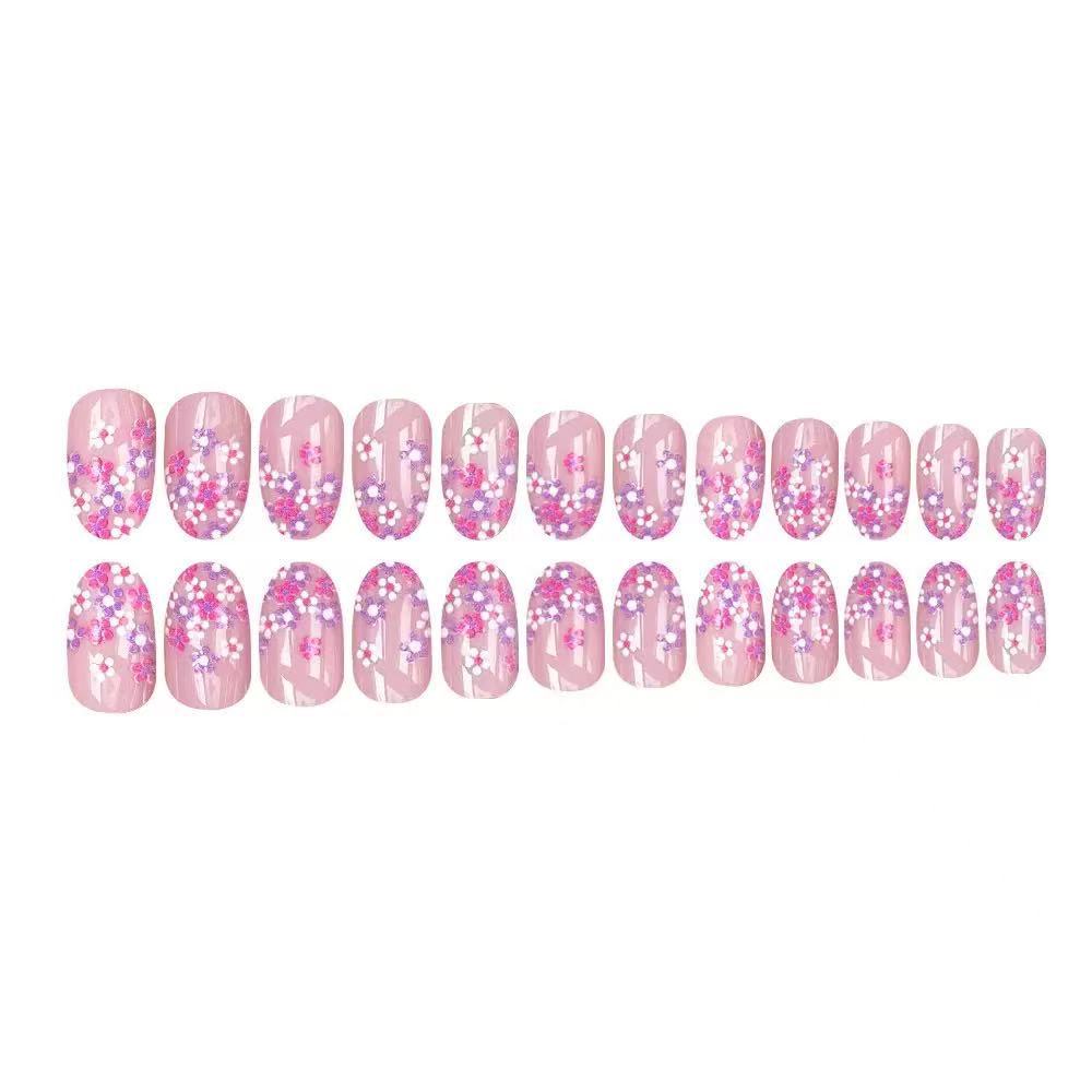 Kunstnagelset mit floralem Design und glitzernden Akzenten Brehn