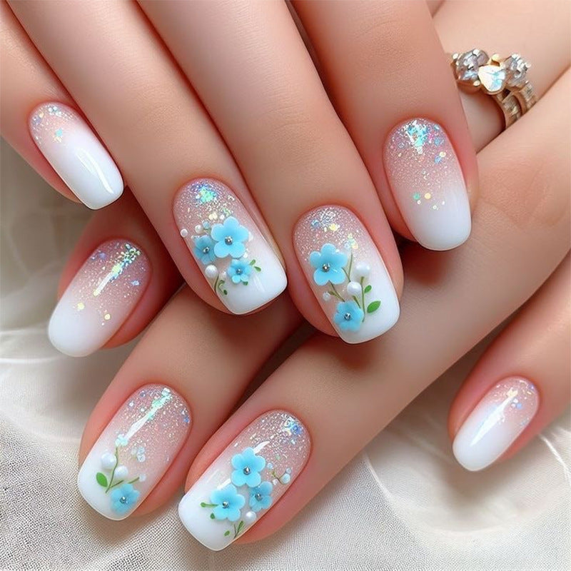 Kunstvolle Nagelverlängerungen mit blumigem Design Brehn