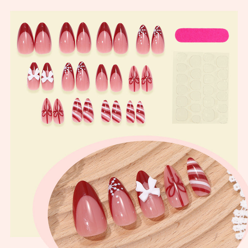 Dekoratives Press-On-Nagelset mit elegantem Bogen und gestreiften Designs Brehn