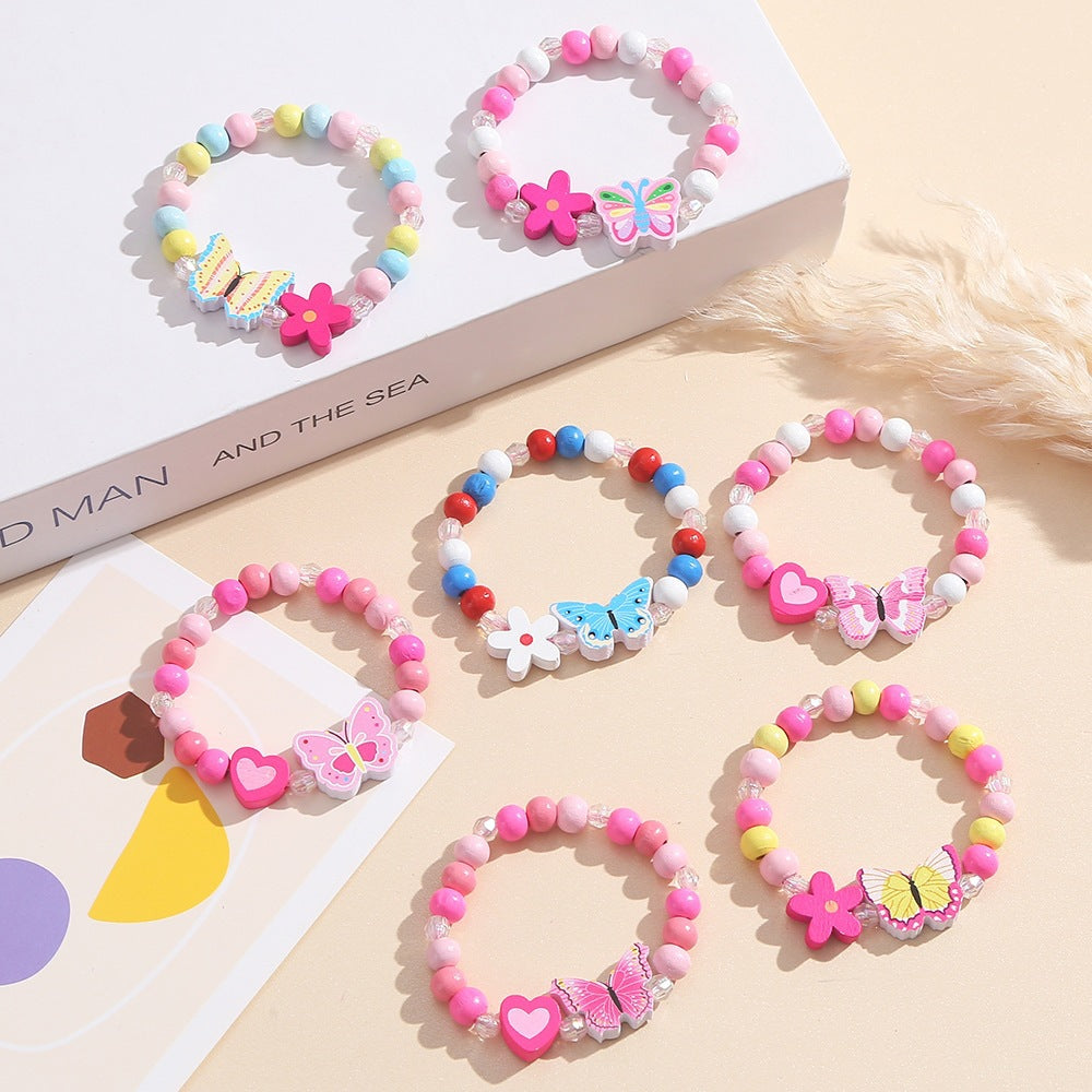 Verspieltes Armband mit Herz- und Schmetterlings-Anhängern Brehn