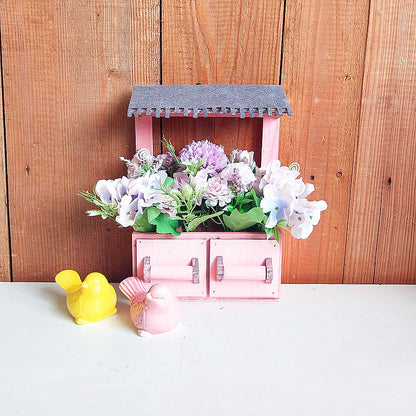 Dekorativer Blumentopf mit Dach