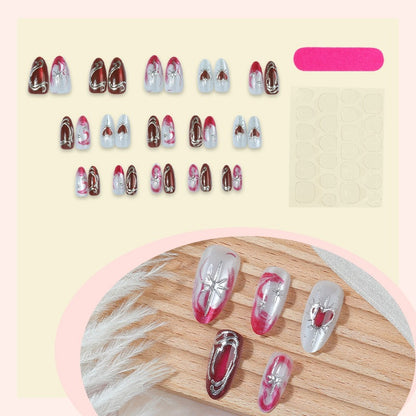 Kunstnagelset mit eleganten Herz- und Glitzermotiven Brehn