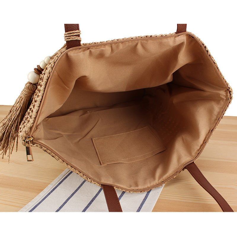 Handtasche Aus Geflochtenem Naturmaterial mit Quastenverzierung Brehn
