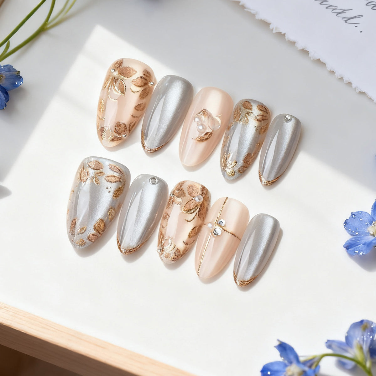 Dekoratives Press-On Nail Art Set mit floralen und metallischen Akzenten Brehn