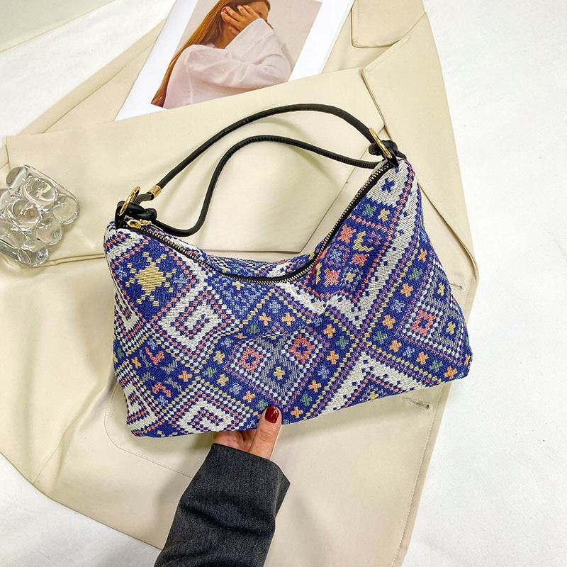 Gepunktete Schultertasche