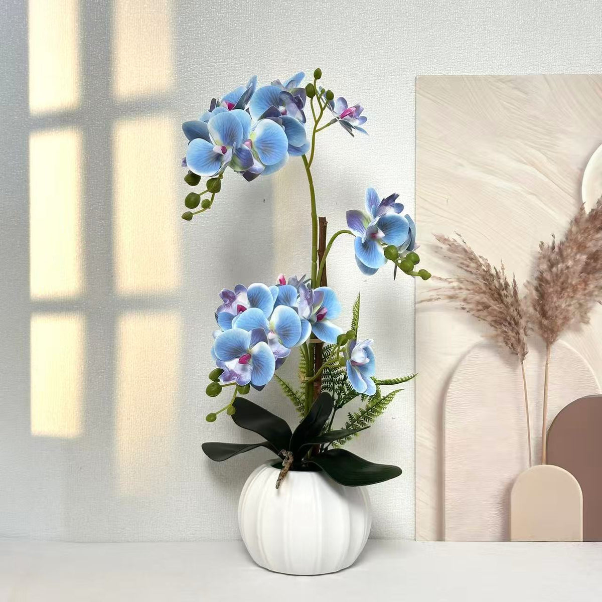 Elegante künstliche Orchideenarrangement für die Innenraumdekoration
