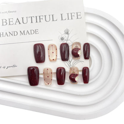 Künstlerisches Press-On Nagelkunst Set mit kreativen Apfel- und Punkten-Designs