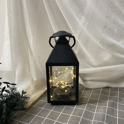 Dekorative Metall- und Glaslaterne mit warmen LED-Feenlichtern Brehn
