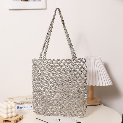 Glitzernde Netzhandtasche Aus Geflochtenem Material Brehn