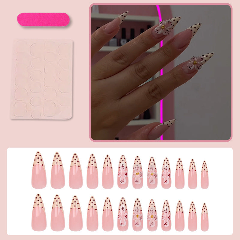Kunstnagelset mit eleganten Blüten- und Punktemotiven Brehn