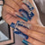 Glamouröse Kunstnagelspitzen mit verzierten Sternen und Glitzer Brehn