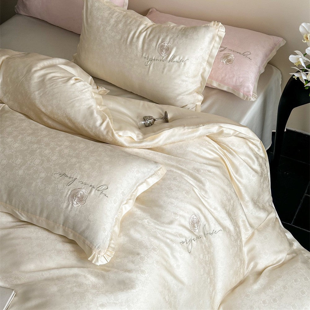Luxuriöse Baumwollsatin-Bettwäschegarnitur mit Jacquard‑Relief und gesticktem Rosenmotiv