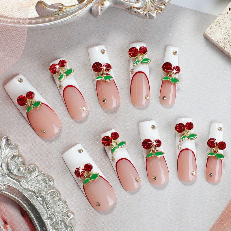 Kunstnagelset mit Kirschmotiv und funkelnden Strasssteinen Brehn