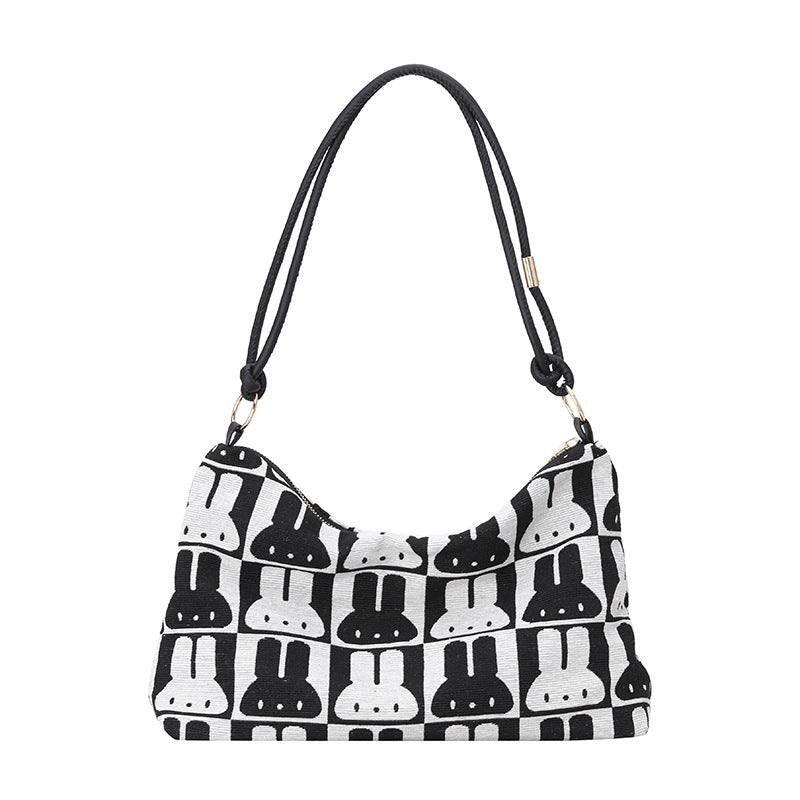Gepunktete Schultertasche