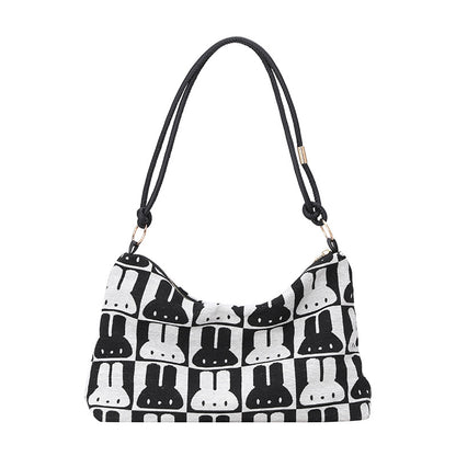 Gepunktete Schultertasche