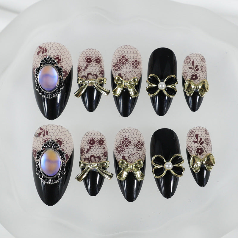Kunstnagelset mit eleganten Punkt- und Schleifenverzierungen Brehn