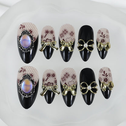 Kunstnagelset mit eleganten Punkt- und Schleifenverzierungen Brehn