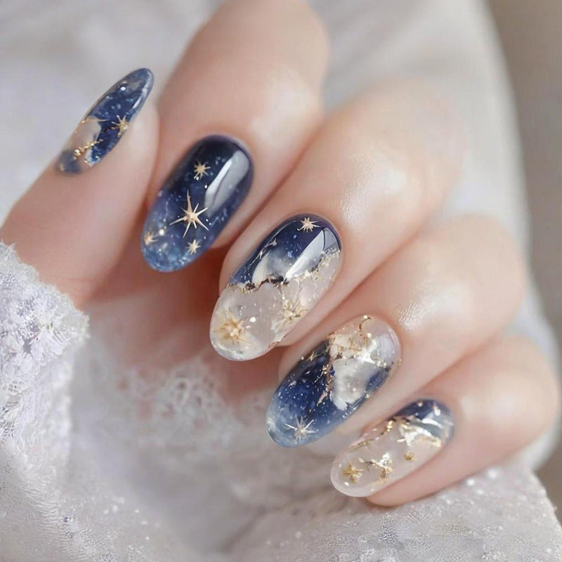 Kunstnagelset mit glamourösen Sternen- und Glitzerdetails Brehn