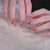 Kunstnagelset mit funkelnden Strassdetails und Herzmotiven Brehn