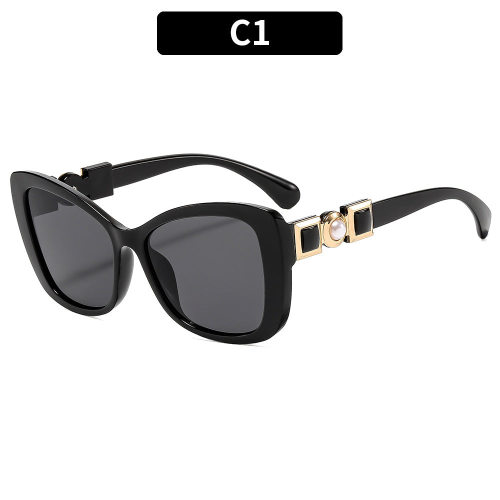 Elegante Katzenaugen-Sonnenbrille mit dekorativem Akzent