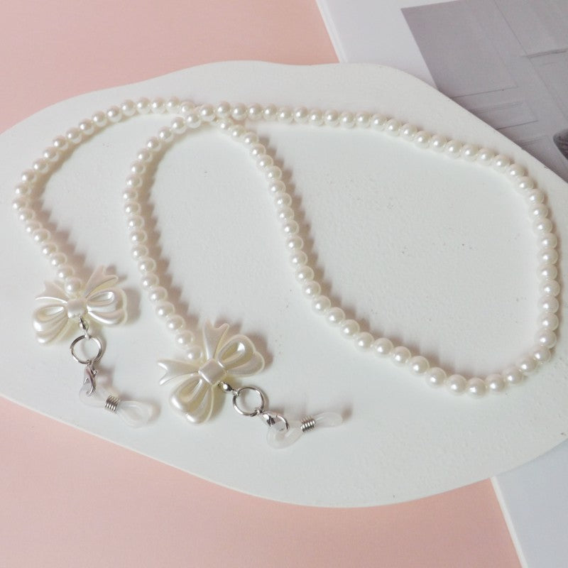 Elegante Perlen-Brillenkette mit Schleifenanhängern Brehn