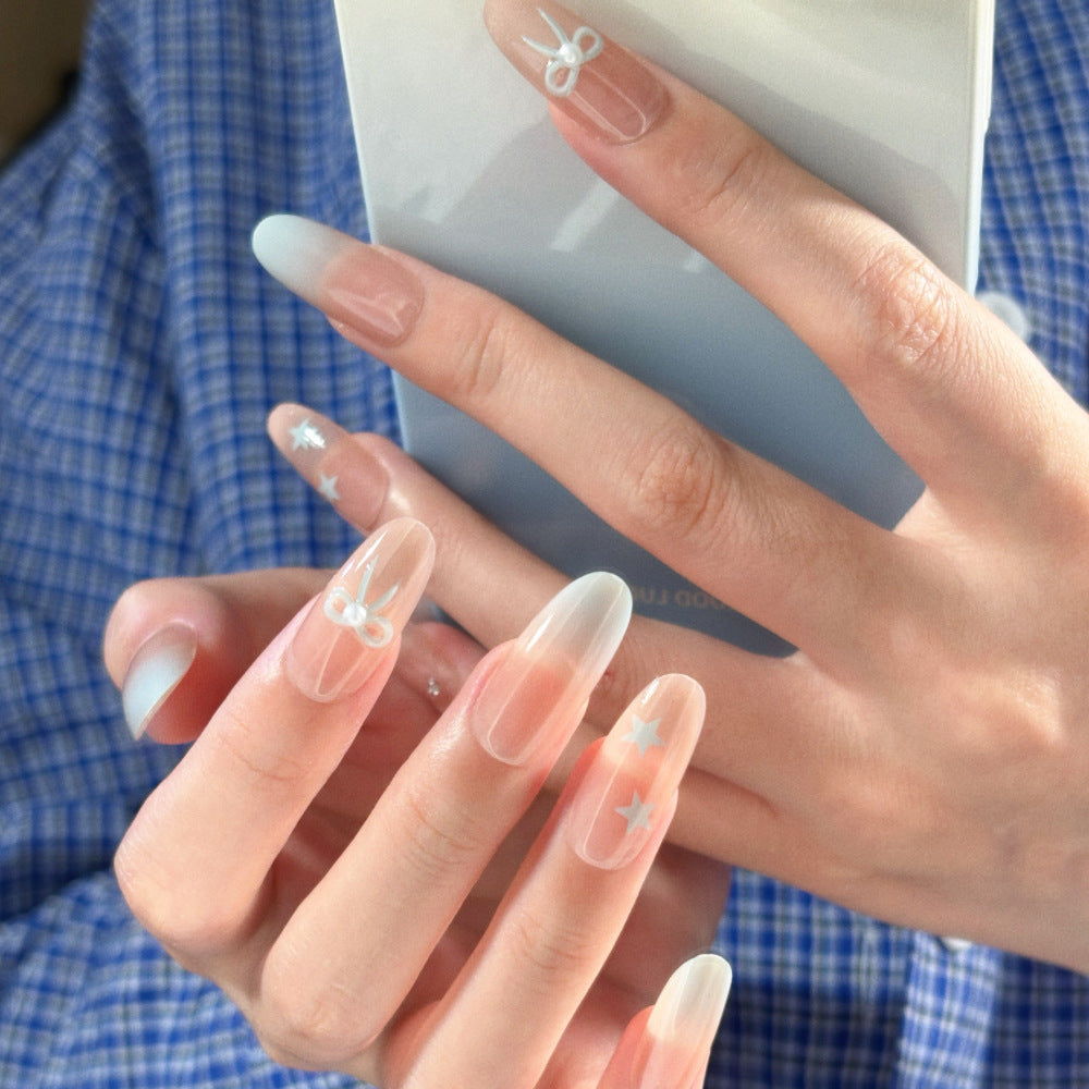 Glamouröse Ombre Press-On Nagelset mit dekorativen Stern- und Schleifenakzenten Brehn