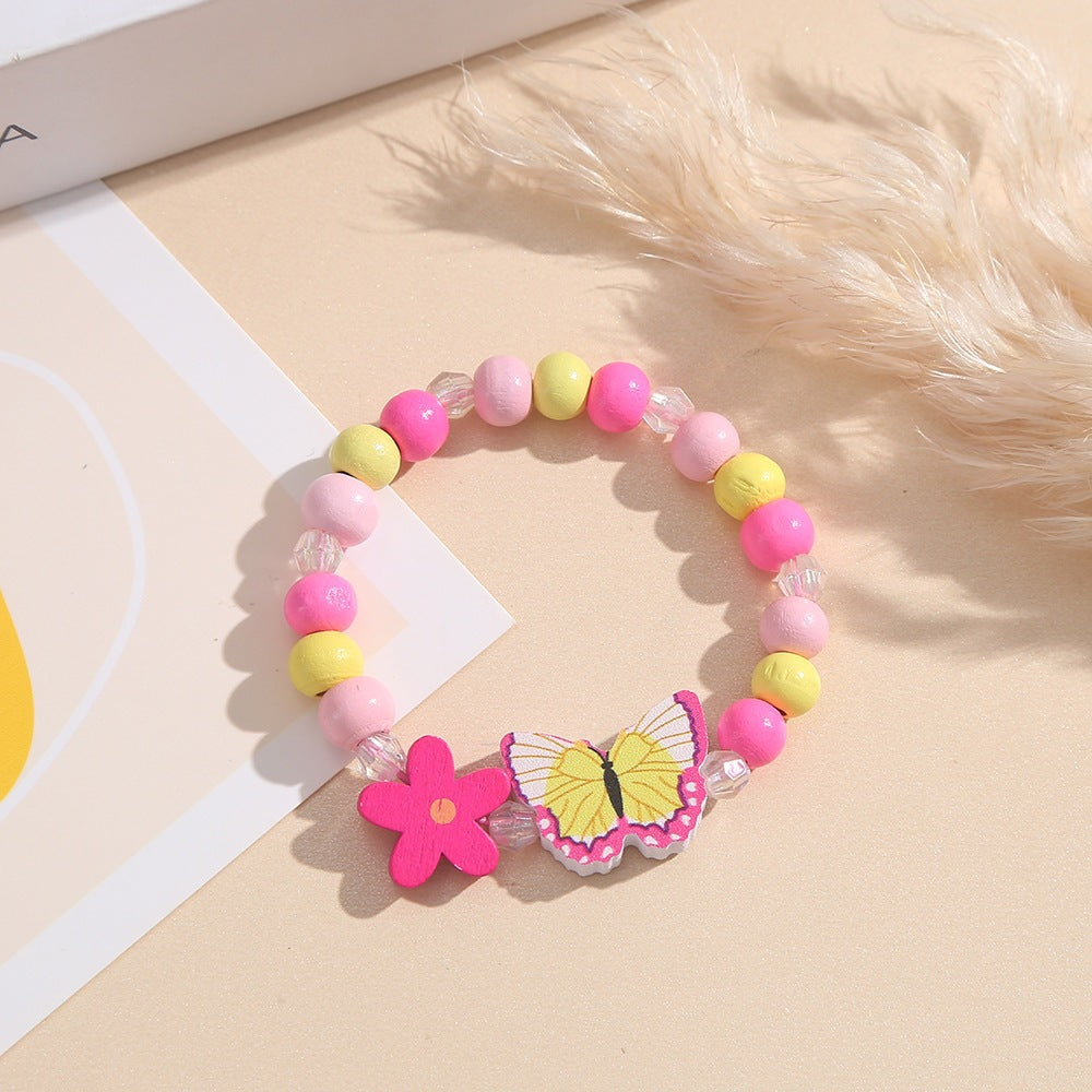 Verspieltes Armband mit Herz- und Schmetterlings-Anhängern Brehn