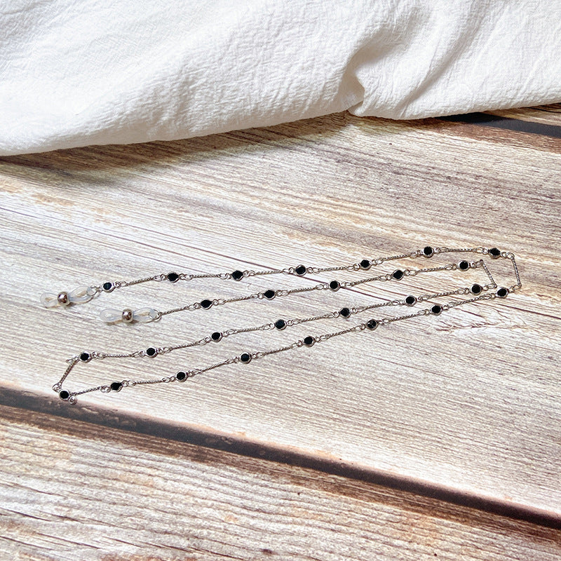 Elegante Schmuckhalterkette mit Onyx-Perlen Brehn