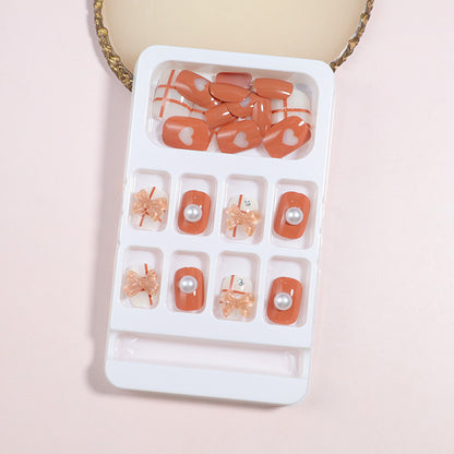 Dekorativer Press-On Nail Art Set mit Schleifenakzenten Brehn