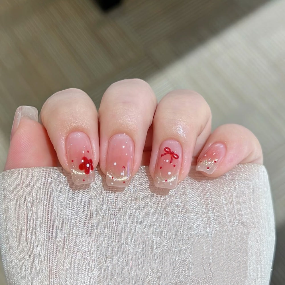 Dekoratives Press-On Nagelset mit floralen und Schleifenakzenten Brehn